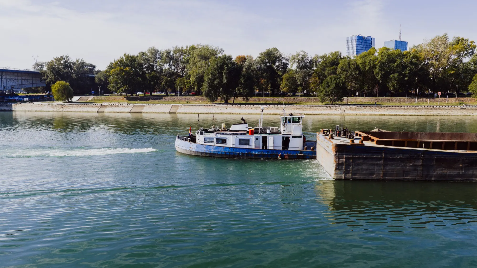 Pusher tug with a loaded barge on the Danube